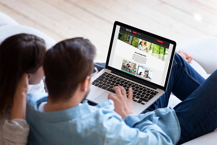 couple looking at Grant UK knowledge hub