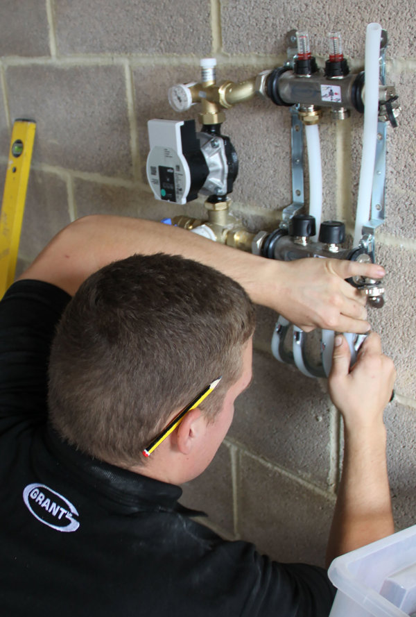 07 Matt connects the pipe loops to the Manifold. Actuator wiring is connected to system controller.JPG