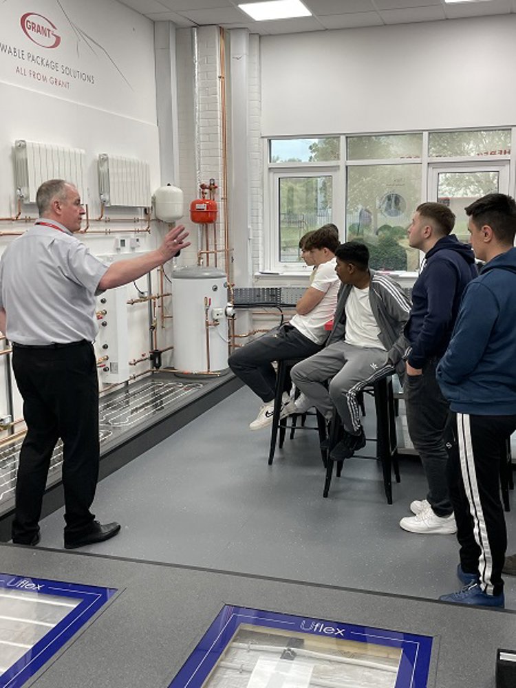 Students from New College Swindon learn about heat pumps with Grant UK